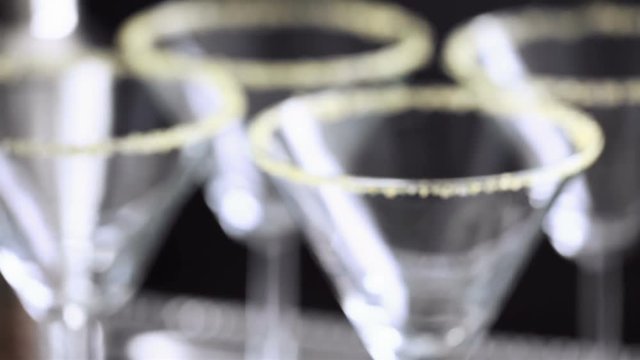 Martini glasses rimmed with brown sugar and set for egg nog cocktail at the minibar