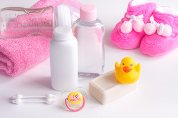 Obraz na płótnie Canvas baby organic cosmetic for bath on white bakground