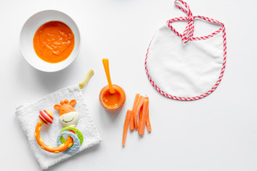 cooking vegetable puree for baby on white background top view