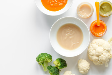cooking vegetable puree for baby on white background top view