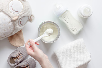 preparation of mixture baby feeding on white background top view