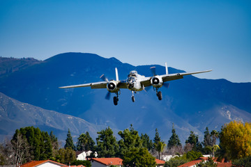Fototapeta na wymiar World War 2 bomber on approach for landing