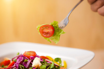 Homemade fresh green vegetable salad on table. Close-up.