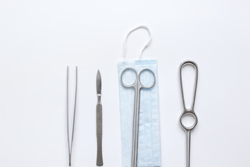 instruments for plastic surgery on white background top view