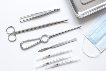 instruments for plastic surgery on white background top view