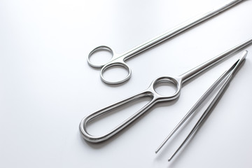 instruments for plastic surgery on white background