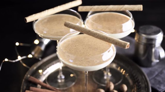 Egg nog cocktail in tall glasses on the tray at the minibar