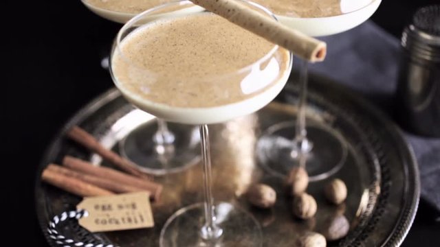 Egg nog cocktail in tall glasses on the tray at the minibar