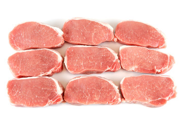 fresh chopped pork tenderloin isolated on white background