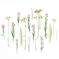 Fototapeta na wymiar Creative wildflowers arrangement on white background. Flat lay, top view. Valentine's background