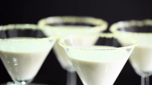Egg nog cocktail in glasses rimmed with brown sugar at the minibar
