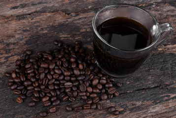 Black coffee isolated on the wooden floor