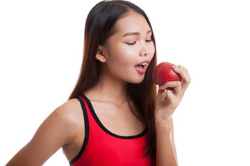 Beautiful Asian healthy girl eat apple.