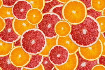 Slices of fresh orange and grapefruit seamless pattern