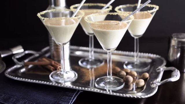 Egg nog cocktail in glasses rimmed with brown sugar at the minibar