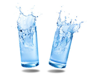 Water splashing out of a glass., Isolated white background.