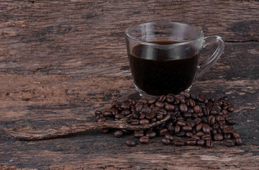 Black coffee isolated on the wooden floor