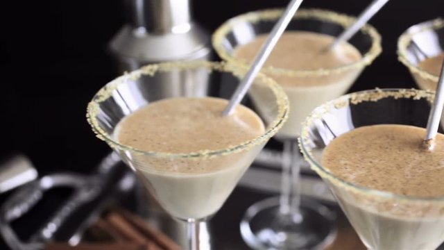 Egg nog cocktail in glasses rimmed with brown sugar at the minibar