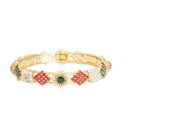 Gold bracelets with gem and diamonds isolate on white background.