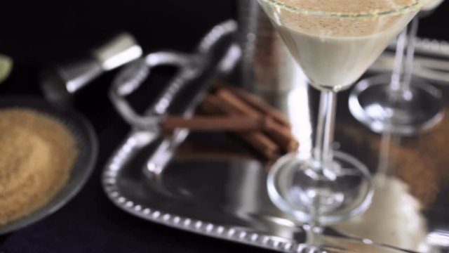 Egg nog cocktail in glasses rimmed with brown sugar at the minibar