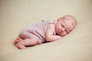 Newborn baby sleeping on a blanket. Close-up