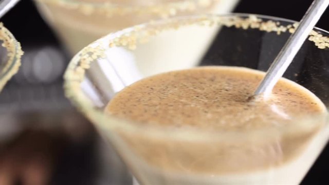Egg nog cocktail in glasses rimmed with brown sugar at the minibar
