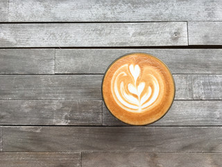 Cup of coffee on a wood table.