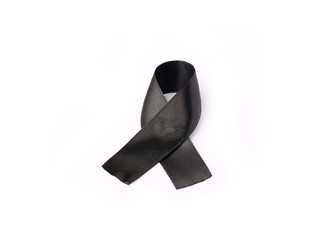 black ribbon bow fabric texture, Ribbon awareness symbol of remembrance campaign or mourning over person's death, Pray for world peace concept