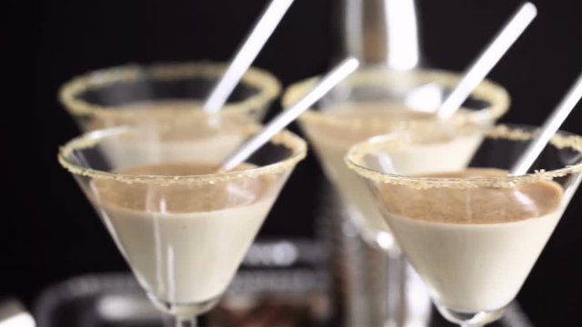 Egg nog cocktail in glasses rimmed with brown sugar at the minibar