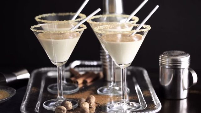 Egg nog cocktail in glasses rimmed with brown sugar at the minibar