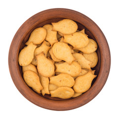 Goldfish Crackers in brown bowl. Isolated on white background.