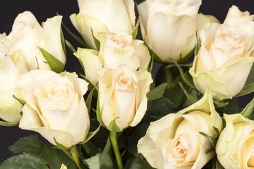  Bouquet of yellow roses on black background