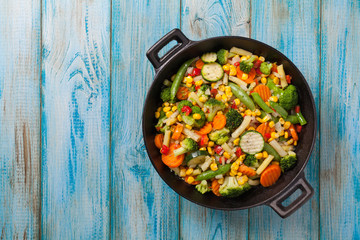 Mix of vegetables fried in a wok.
