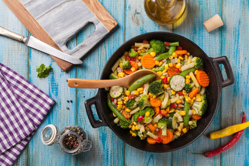 Mix of vegetables fried in a wok.