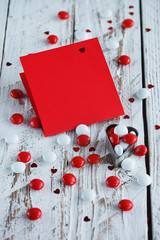 Valentine's day card with small hearts and red/white candy