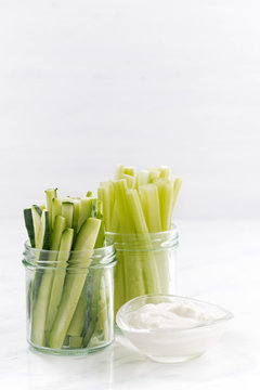 healthy snacks, green vegetables and yogurt, vertical