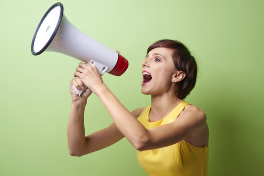 Female model shouting through megaphone