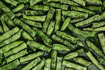 Fresh frozen green french bean with hoarfrost closeup as background. Healthy vitamin food.