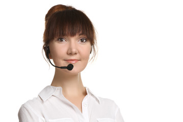 Portrait of a young smiling woman with headset working in a call center. Isolated.
