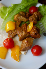 Seitan on white plate with the vegetables