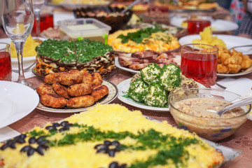 Festive dinner at home, Christmas Day. Bacon, cheese balls, frie