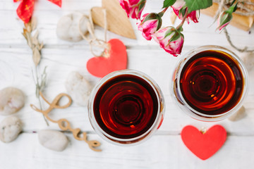 Two wine glasses with heart and letters Love
