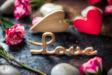 Word LOVE on rustic surface