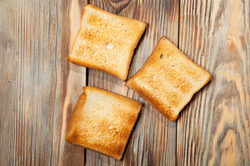 Toast on a rustic wooden background