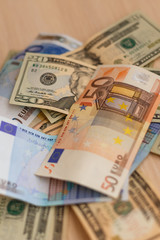 Cash on table isolated: dollars, euro broken money All in mess, global crisis concept
