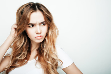 Fototapeta premium lifestyle and people concept: Young casual woman portrait. Clean face, curly hair. 