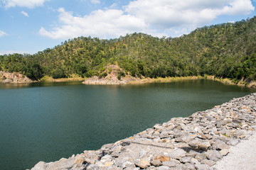 The Srinagarind Dam is an embankment dam in Kanchanaburi Province, Thailand. The main purpose of the dam is river regulation and hydroelectric power generation.
