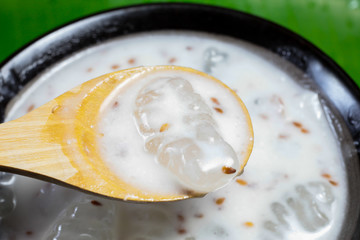 Caramelized crisps in coconut sauce. Thai dessert.