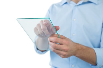 Mid section of man using futuristic digital tablet