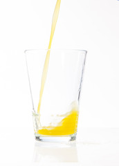 pouring glass of orange juice 